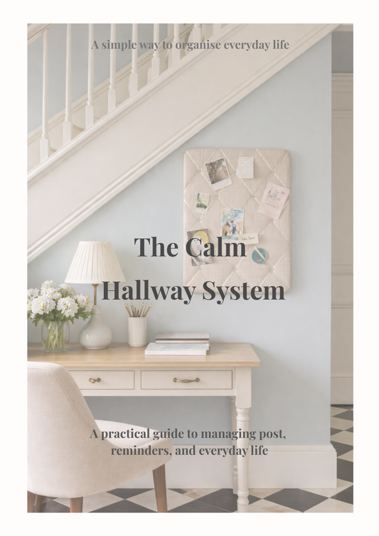 Calm hallway organisation idea with fabric notice board displaying post and reminders, styled console table and neutral interior decor