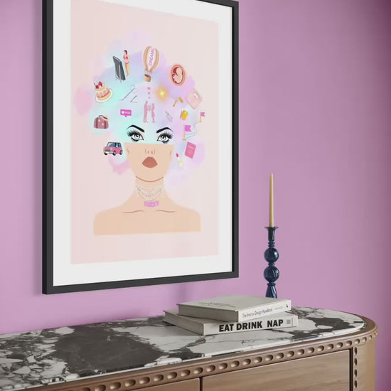 Framed limited edition art print “February — Desire?” shown in a calm  pink interior slow zoom into thoughtful presence in the space.